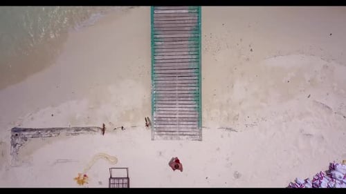 Two people suntan on marine shore beach journey by turquoise ocean and white sand background of the