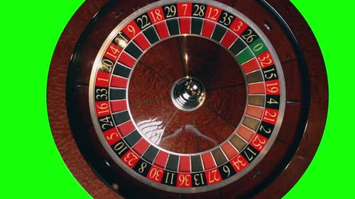 Close Up of Roulette Wheel in Motion at a Green Screen Background