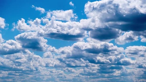 Time Lapse of Puffy Clouds Against Blue Sky