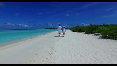 Man and lady happy together on tropical island beach journey by blue green ocean and white sandy bac