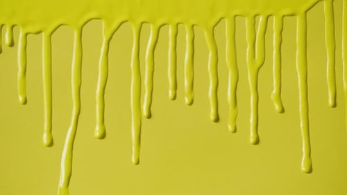 Yellow Paint Background Color Tint Drops on Wall Closeup