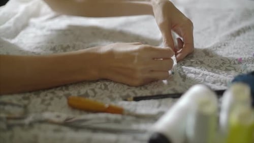 Seamstress With Stitching Pin On Fabric