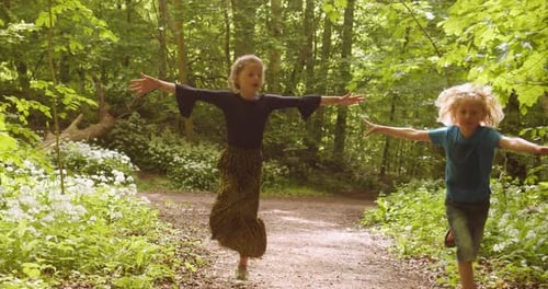 Beautiful Shot of Happy Children Playing and Running with Arms Stretched
