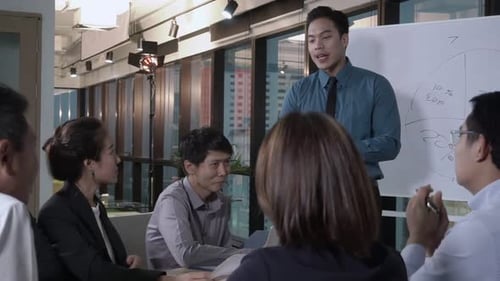 Asian Business People Discuss Marketing Strategy