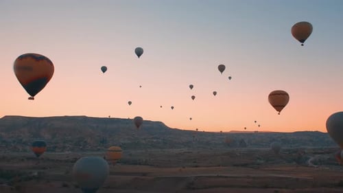 Breathtaking Hot Air Balloons at Sunrise Over Desert