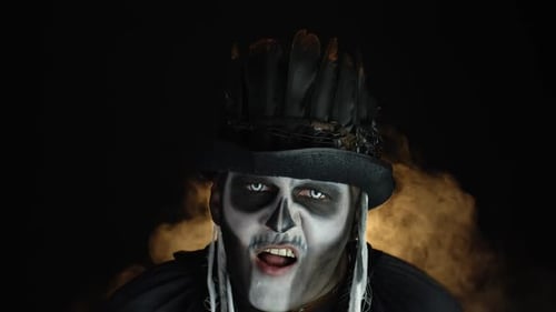 Adult Man in Skeleton Makeup with Hat Screaming