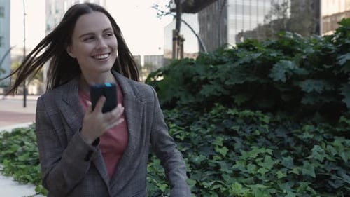 Smiling Young Business Woman Professional Talking on Phone in City Street