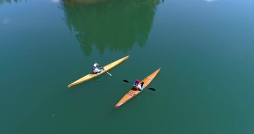 People kayaking in lake 4k