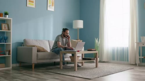 Busy Man Is Working at Home