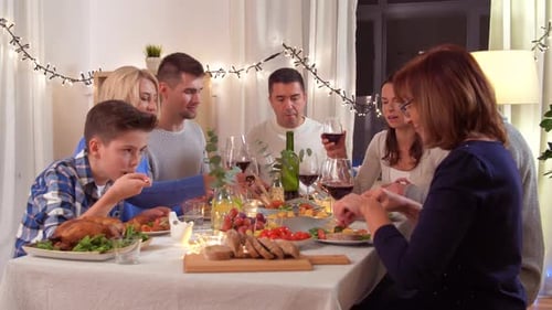 Family Gathered at Festive Dinner Table