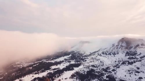 Epic Aerial Flight Near Mountain Clouds Towards Sunrise. Picturesque and Gorgeous Scene.