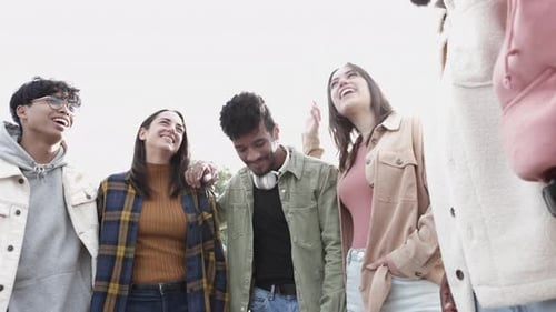Smiling Friends Standing Together in Urban Setting