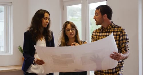 Millennial creative professionals working in a creative office