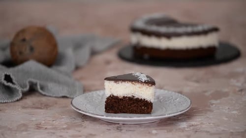 Chocolate Cake with Coconut Filling Being Cut