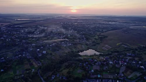 Village Hills and Fields During Evening Sunset