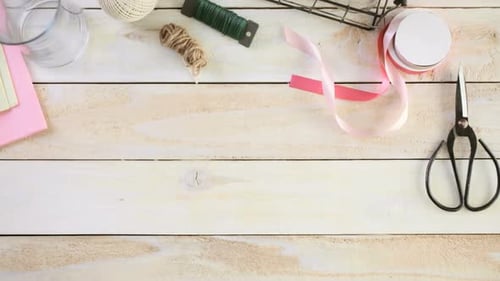 Hands Arranging Beautiful Pink Tulip Bouquet on Table