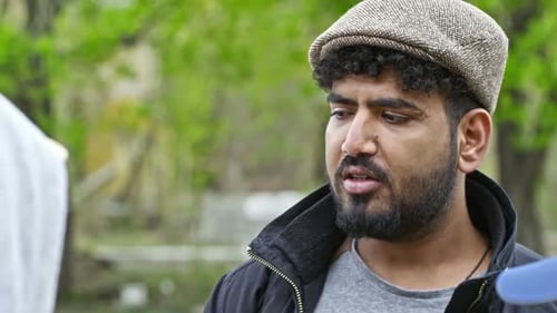 Man With Beard Talking Outside in Nature