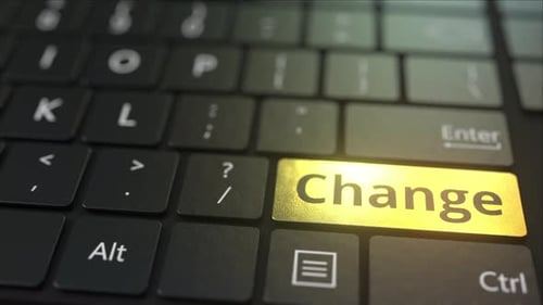Black Computer Keyboard and Gold Change Key