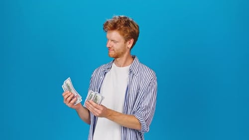 Young Adult Counting One Hundred Dollar Bills