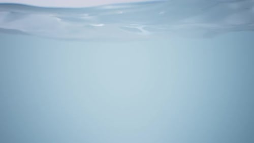 Clean Water surface. Water waving slow motion. Colorful water.