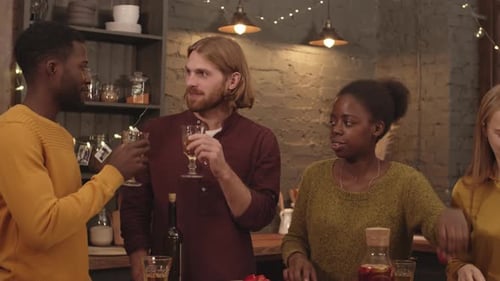 Friends Drink Wine and Prepare Food Together