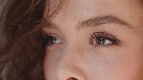 Woman's Face Close Up with Brown Curly Hair
