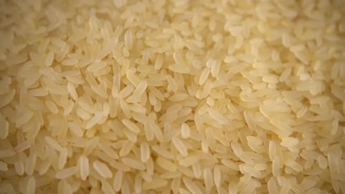 Dry Rice Being Poured Into Bowl, Close Up