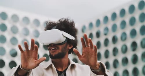 Man Experiences Virtual Reality Headset in Urban Setting
