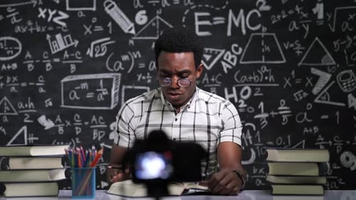 Teacher Explains Math Concept to Camera in Classroom