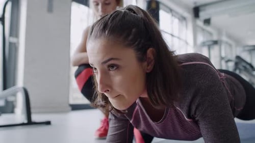 Young woman during hard workout at gym. Shot with RED helium camera in 8K