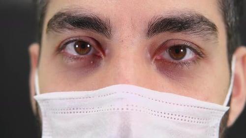 Close Up of Eyes with Medical Mask