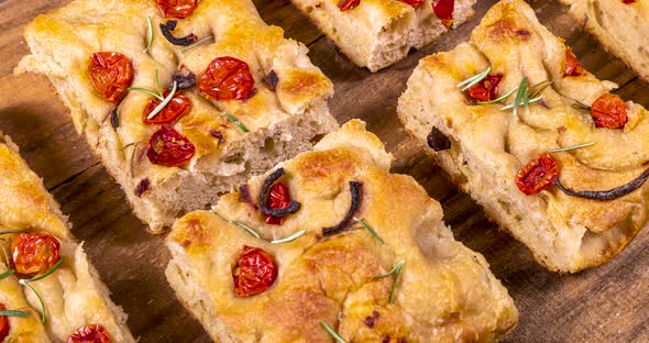 Homemade italian flat bread - Focaccia contorta. With olives, olive oil ...