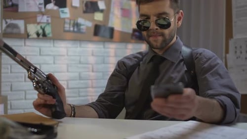 Detective Talking on Phone While Holding Revolver