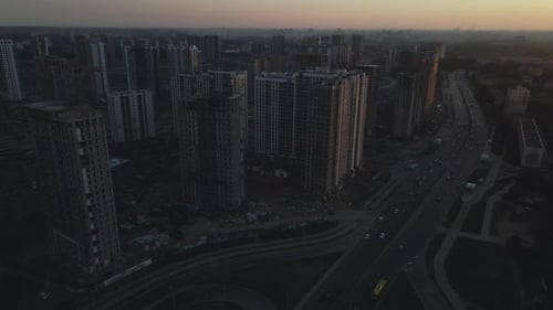 City block construction site. Multi-storey buildings. City landscape at sunrise. Aerial photography.
