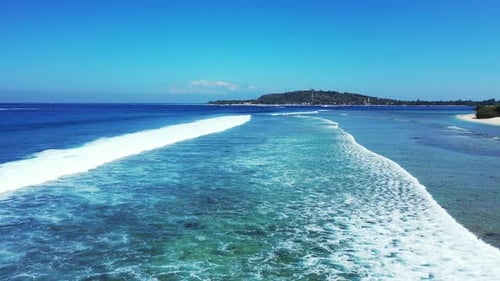 Daytime fly over copy space shot of a summer white paradise sand beach and turquoise sea background