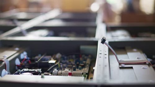 Slider Shot of a Metal Components and Microcircuits in Workshop Laboratory