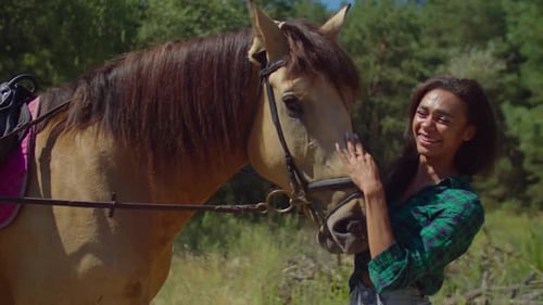Cheerful Caring Horsewoman Bonding with Horse