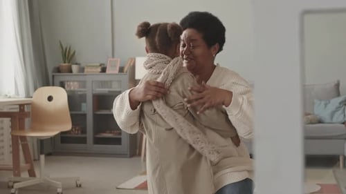 Loving Grandmother Welcoming Grandchild with Warm Hug