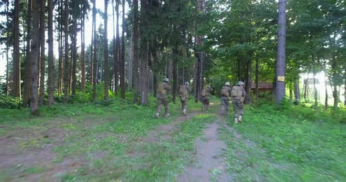 Soldiers Taking Aim From Rifle in Forest Smoke in Background Military and Army Concept