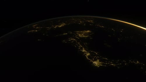 Earth from Space at Night Approaching Sunrise