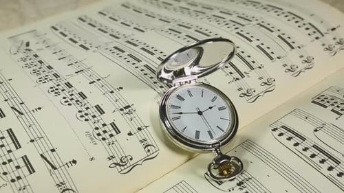 Antique Pocket Watch on Sheet Music