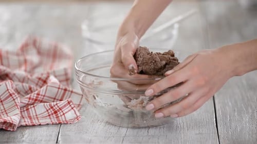 Female Hands Knead Fresh Homemade Doughin Bowl. Home Baking Pastries