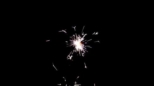 Sparkler Emitting Twinkling Sparks on Black