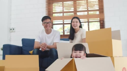 Happy Family Celebrates Moving into New Home