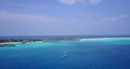 Luxury flying copy space shot of a summer white paradise sand beach and turquoise sea background in