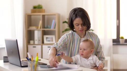 Working Mother with Baby Boy at Home Office 5