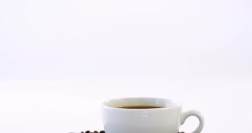 Coffee Mug on Top of Coffee Beans