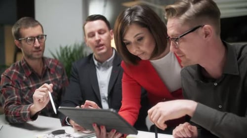 Business People Talking Strategy With Tablet At Office Desk. In Creative Team In Office Productive