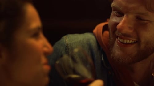 Couple Drinking Red Wine on a Romantic Date