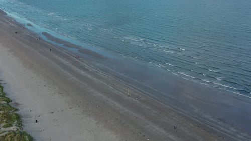 Irish sea and marram grass anchored dunes.